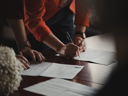 people signing papers for their grant for nonprofits