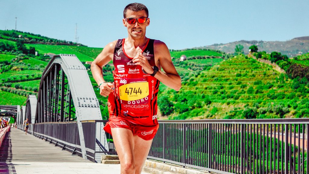 Runner with a fitness tracker taking part in a running event.